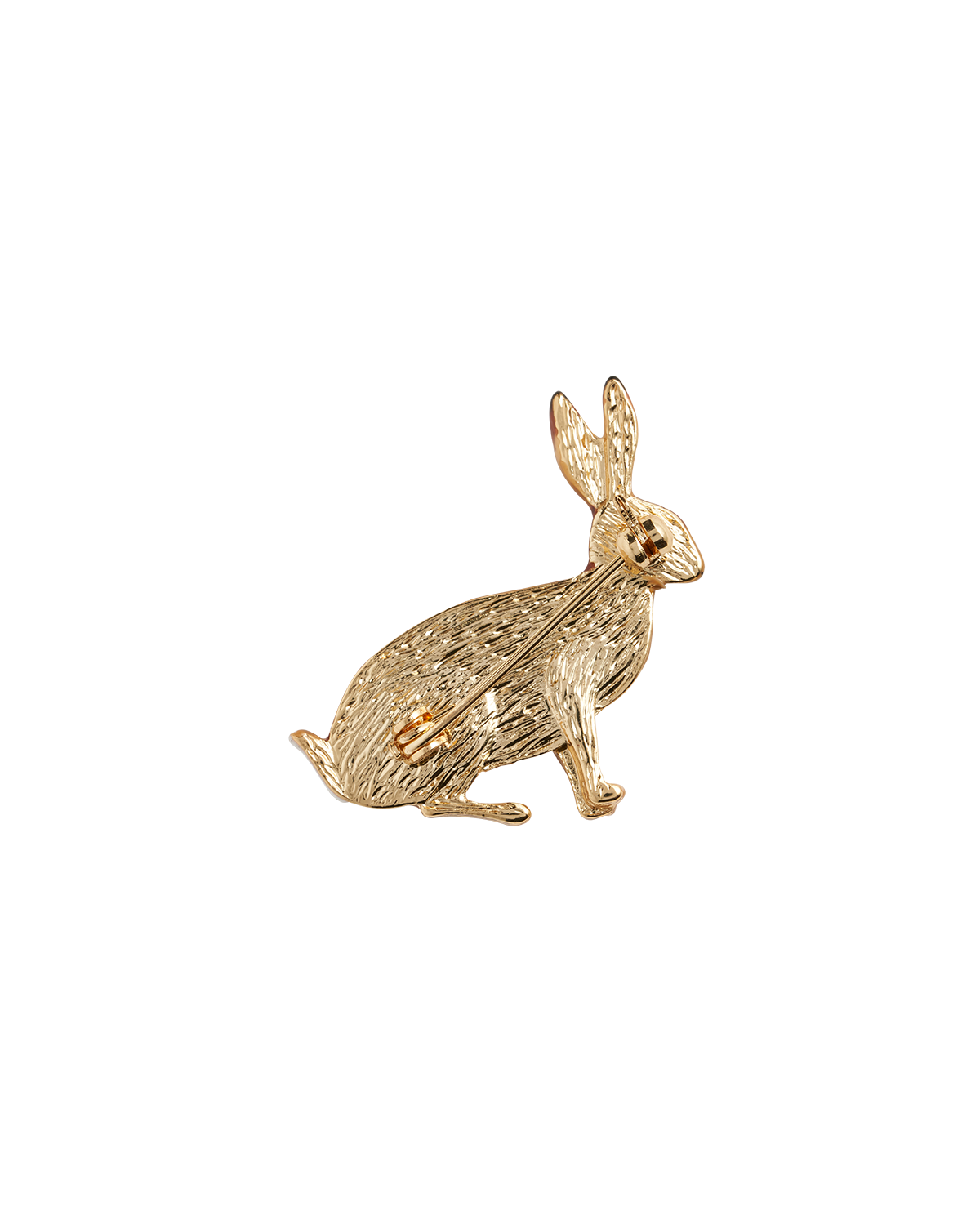 Gold rabbit-shaped brooch on a white background