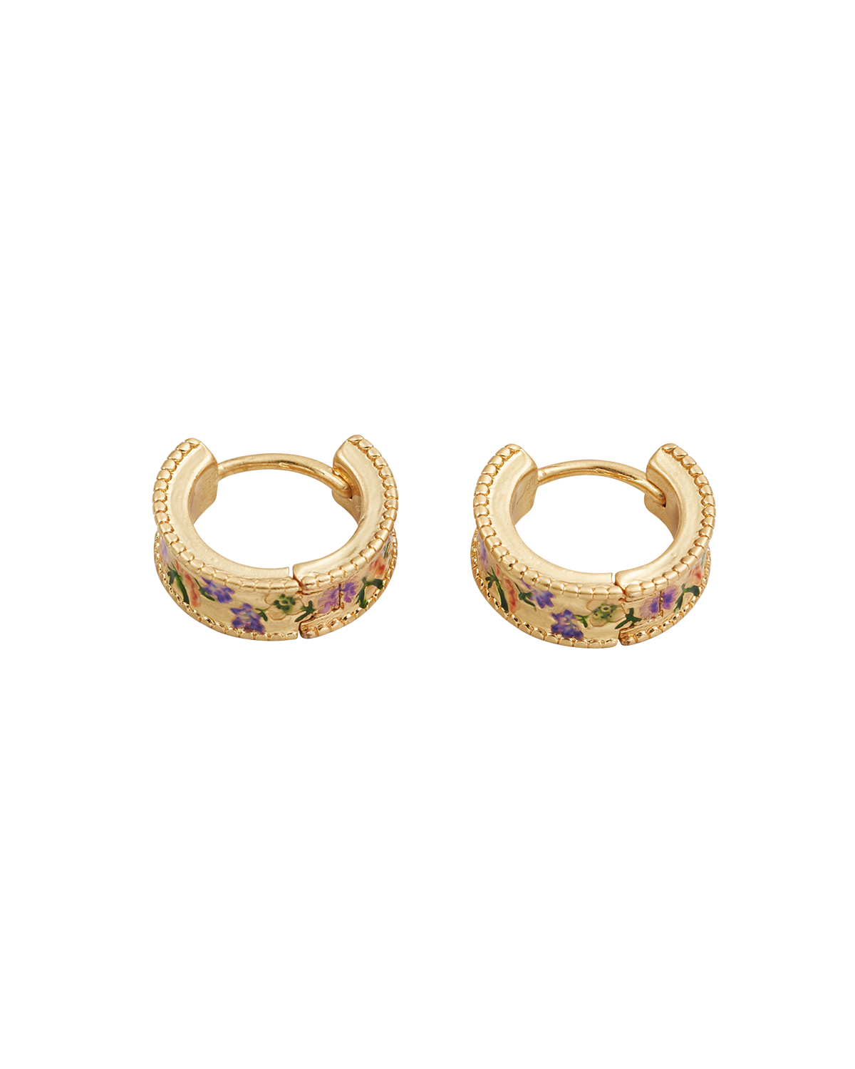 Gold hoop earrings with floral designs on a white background