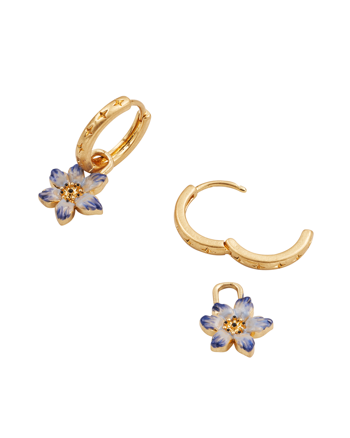 Gold hoop earrings with floral charms on a white background