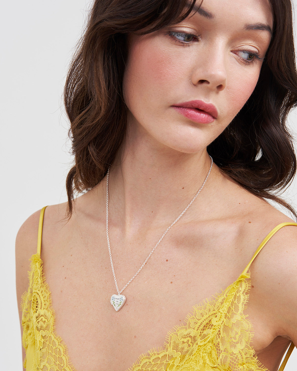 Silver Forget Me Not Heart Locket Necklace on woman