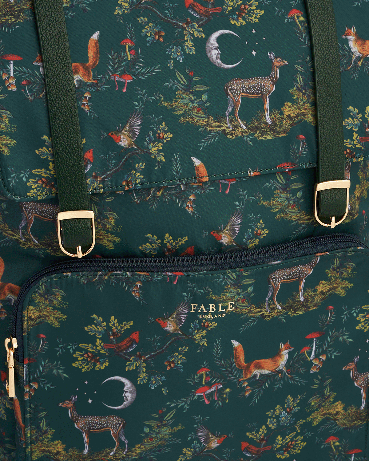 Patterned bag with woodland animals and Fable England branding on a dark green background