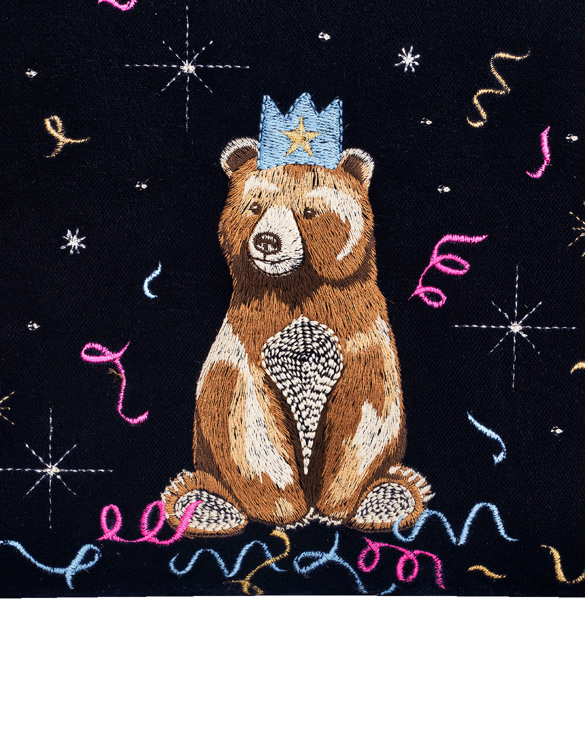 Embroidered bear with a crown on a blue background with decorative elements
