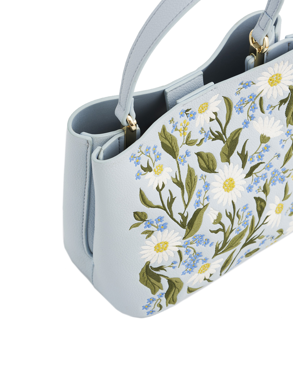 Light blue handbag with floral embroidery on a white background