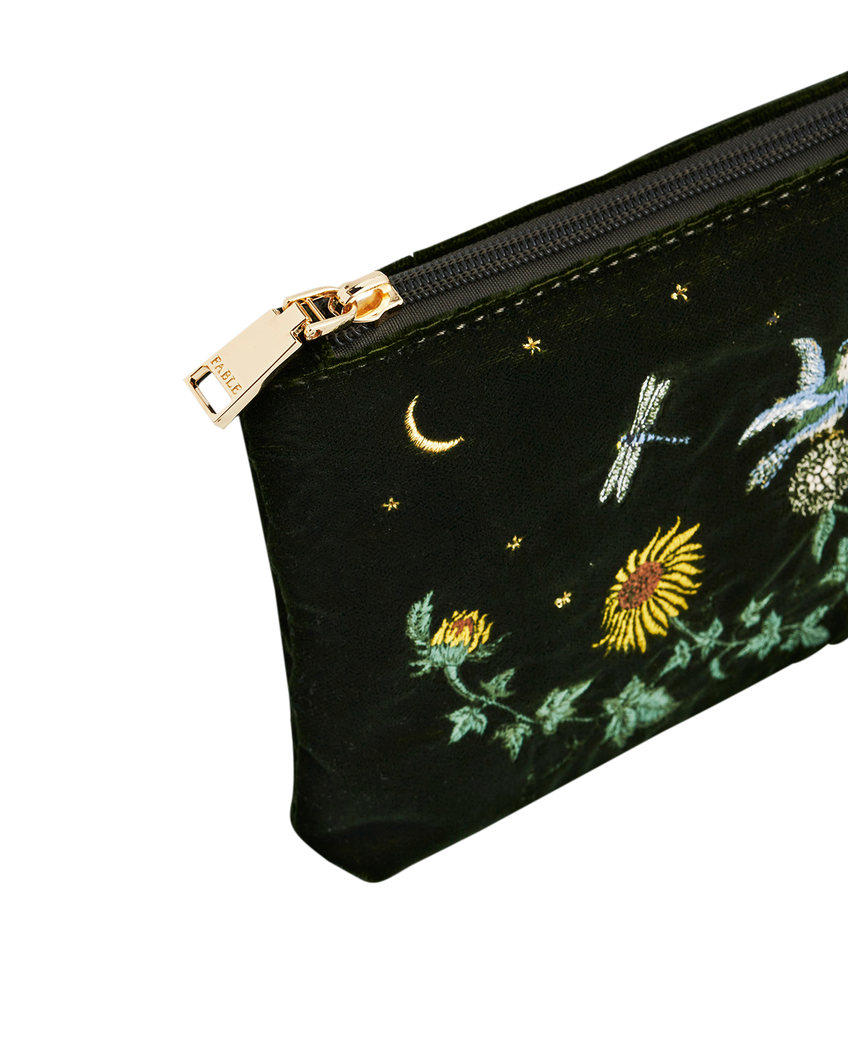Green pouch with gold zipper and embroidered designs on a white background