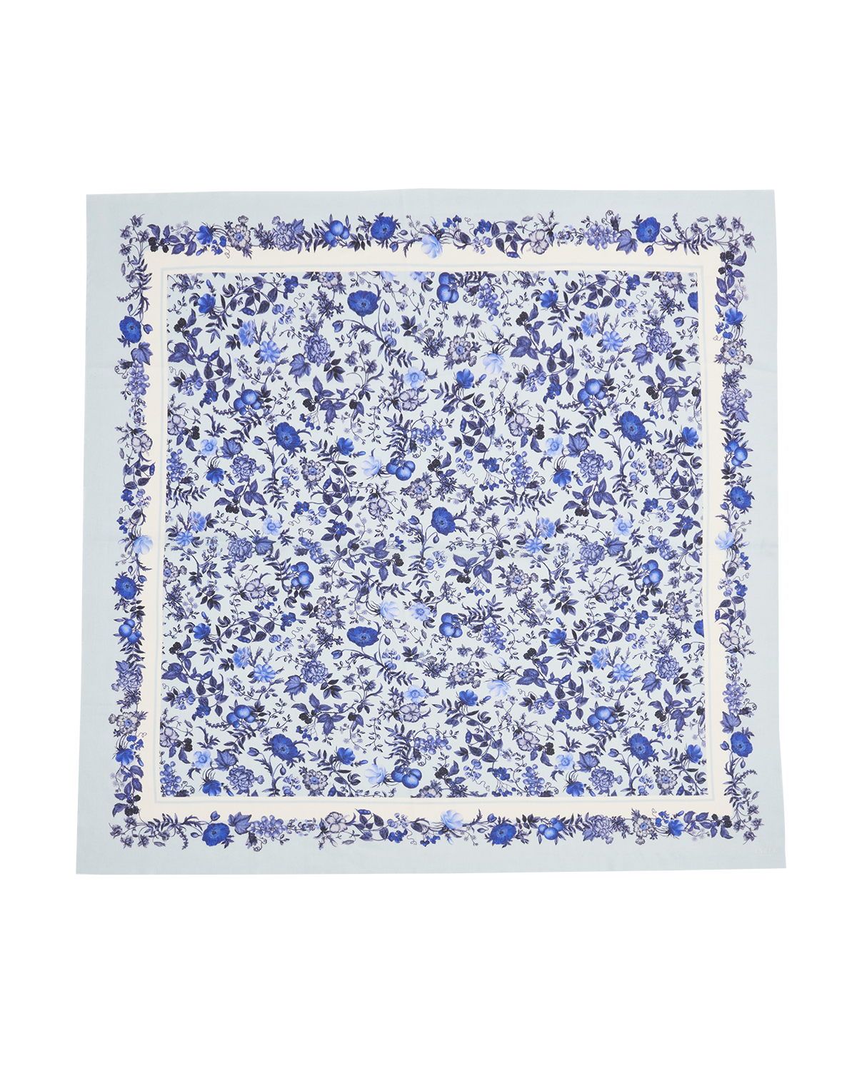 Floral patterned fabric square with blue flowers on a white background