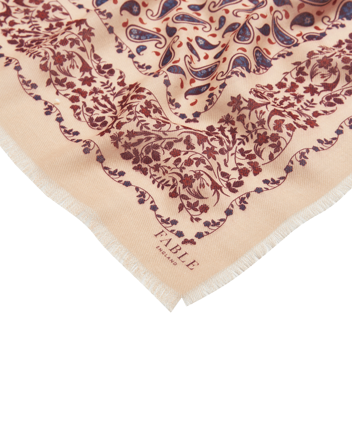 Beige scarf with red paisley pattern and 'Fable England' branding
