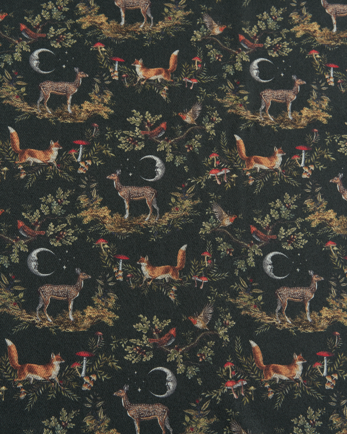 Pattern of forest animals and elements on a dark green background