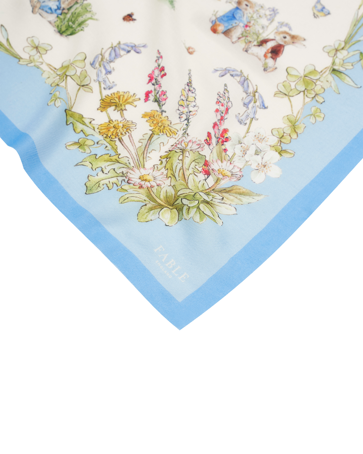 Fable England x Peter Rabbit Cream Rectangle Scarf featuring delicate illustrations and a light blue trim.