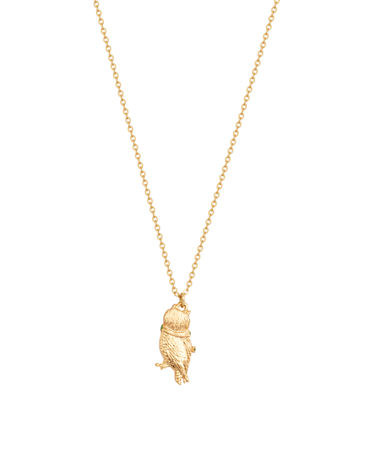 Gold owl pendant necklace on a white background