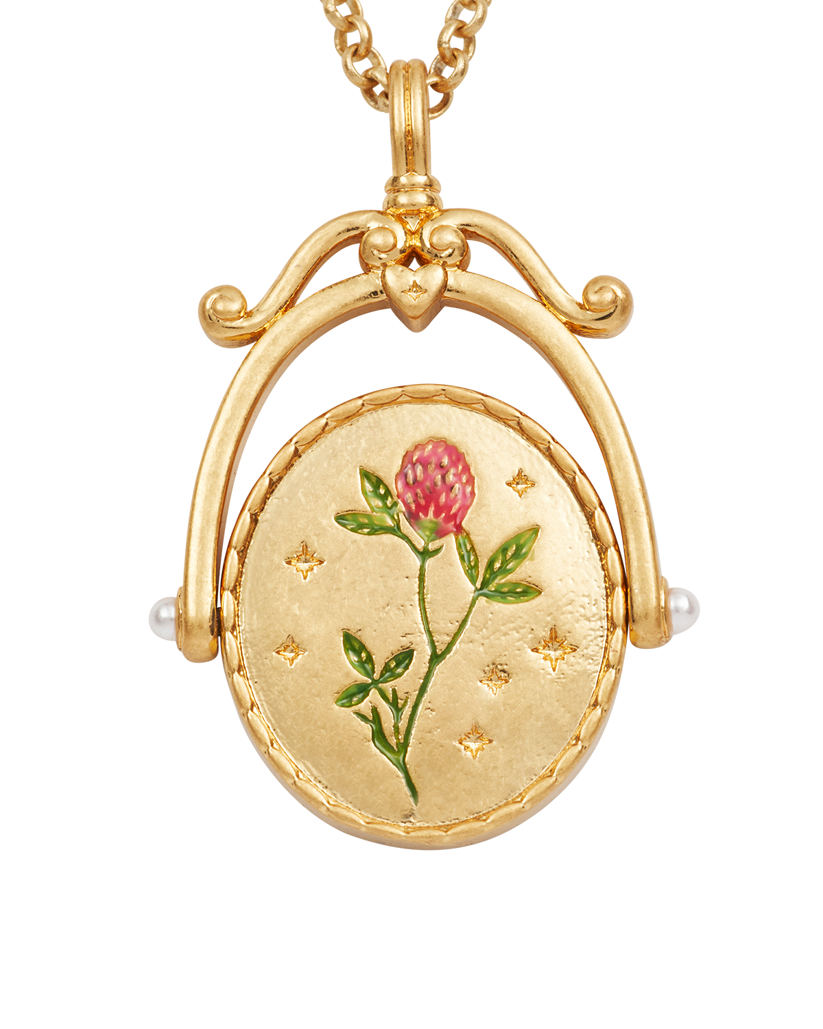 Gold locket with a pink flower design on a white background