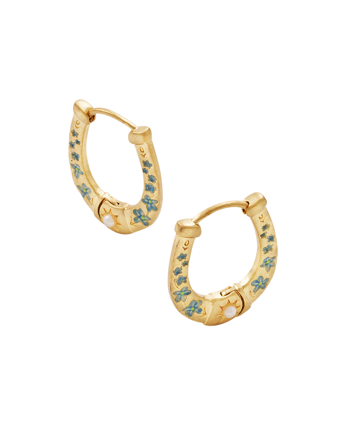 Gold horseshoe hoop earrings with enamel flowers on a white background