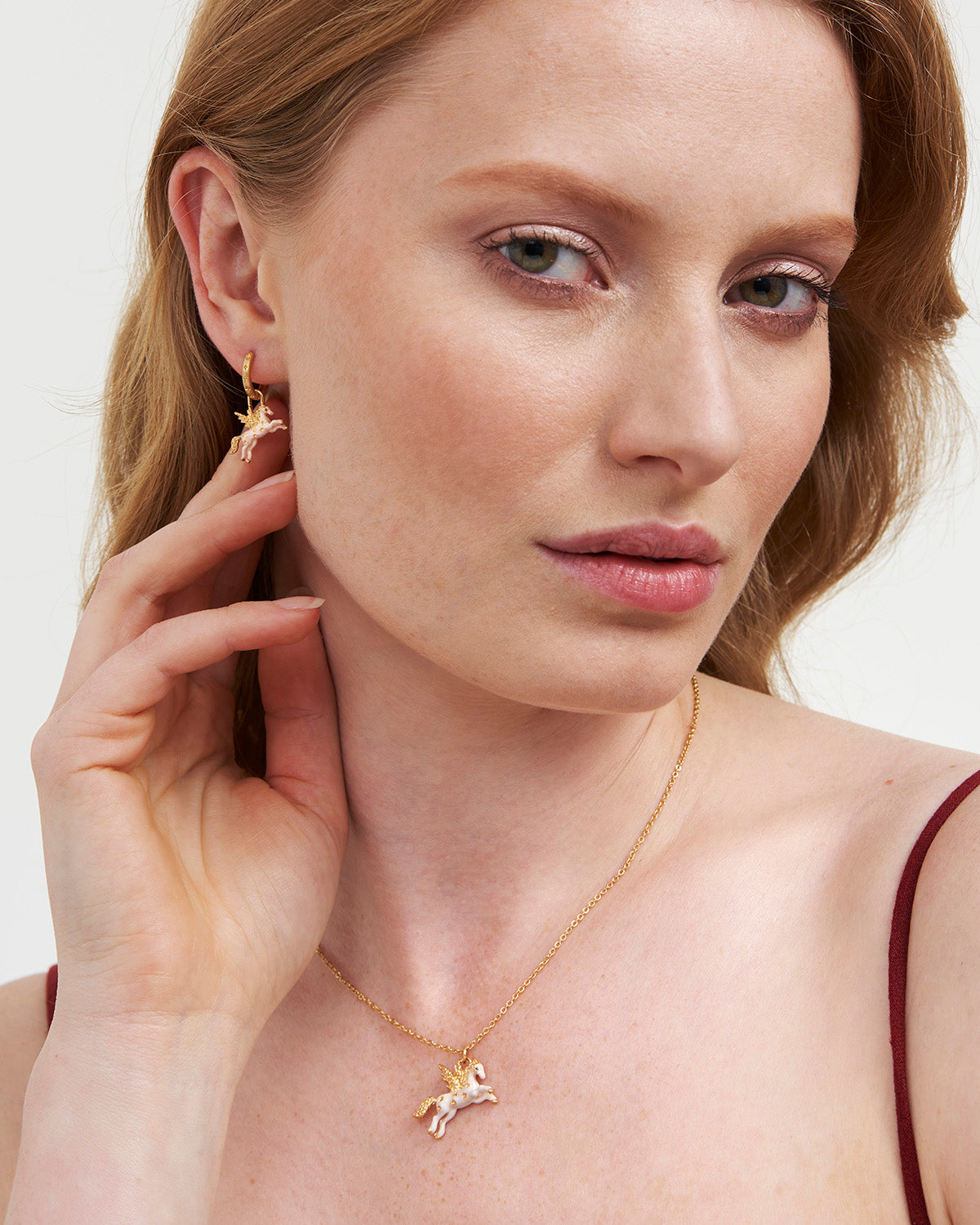 Pegasus earrings on model