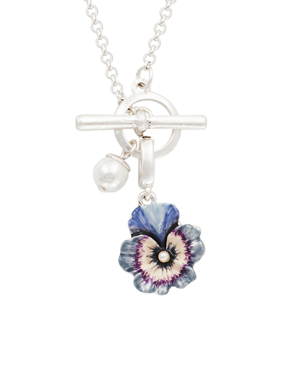 Silver necklace with a floral pendant and pearl charm on a white background