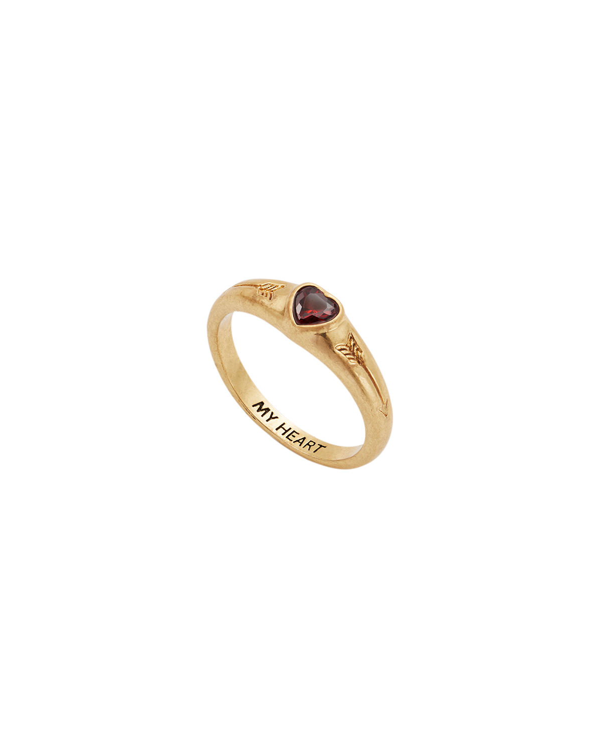 Gold ring with a heart-shaped gemstone on a white background