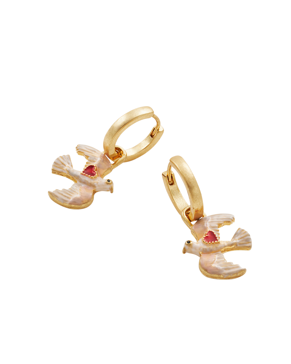 Gold earrings with red gemstones on a white background