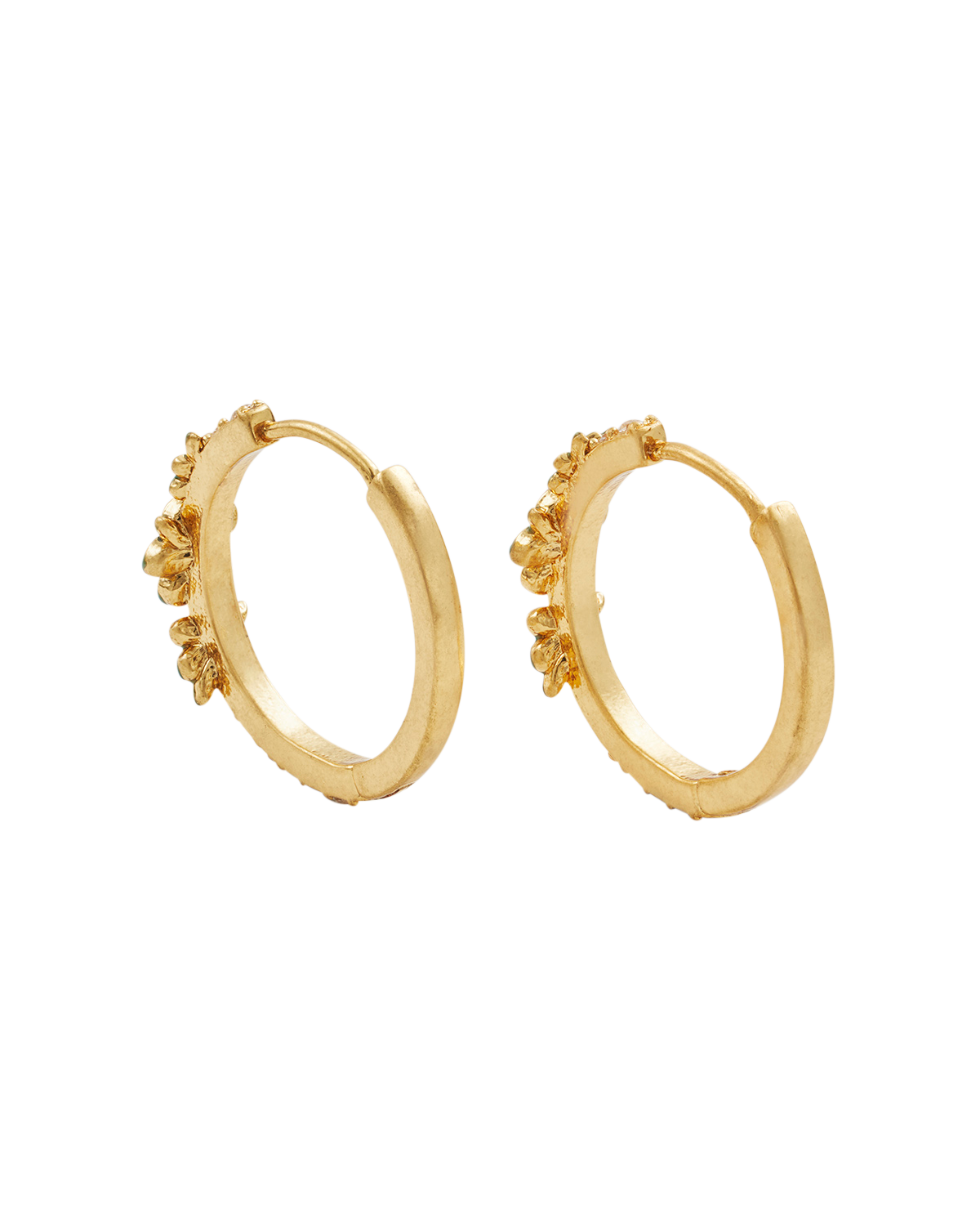 Gold hoop earrings with floral designs on a white background