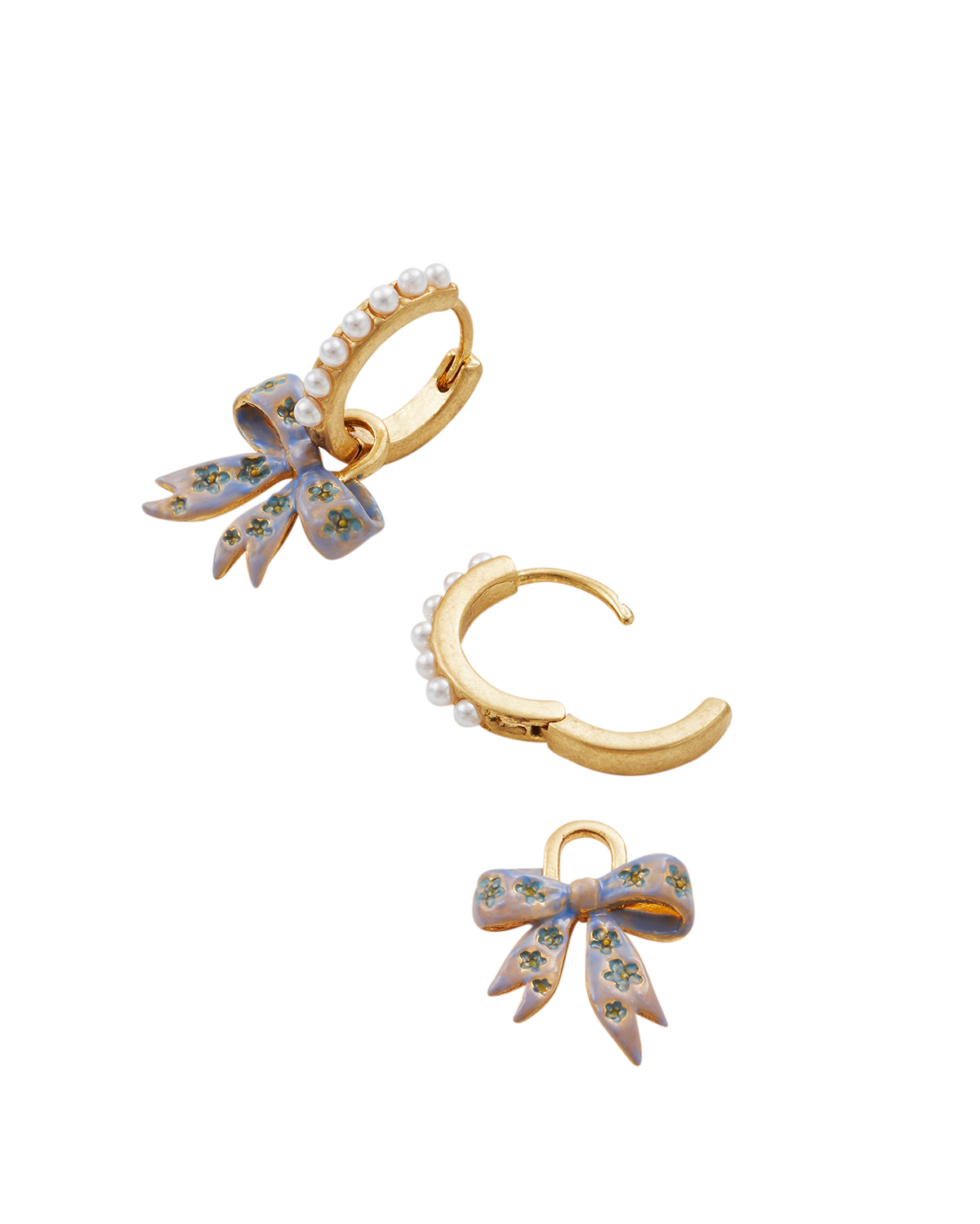 Gold Forget Me Not Bow Huggie Earrings on a white background