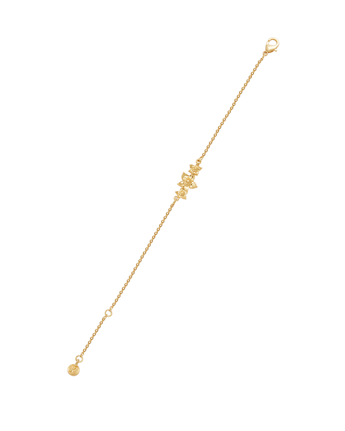 Gold bracelet with a small charm on a white background