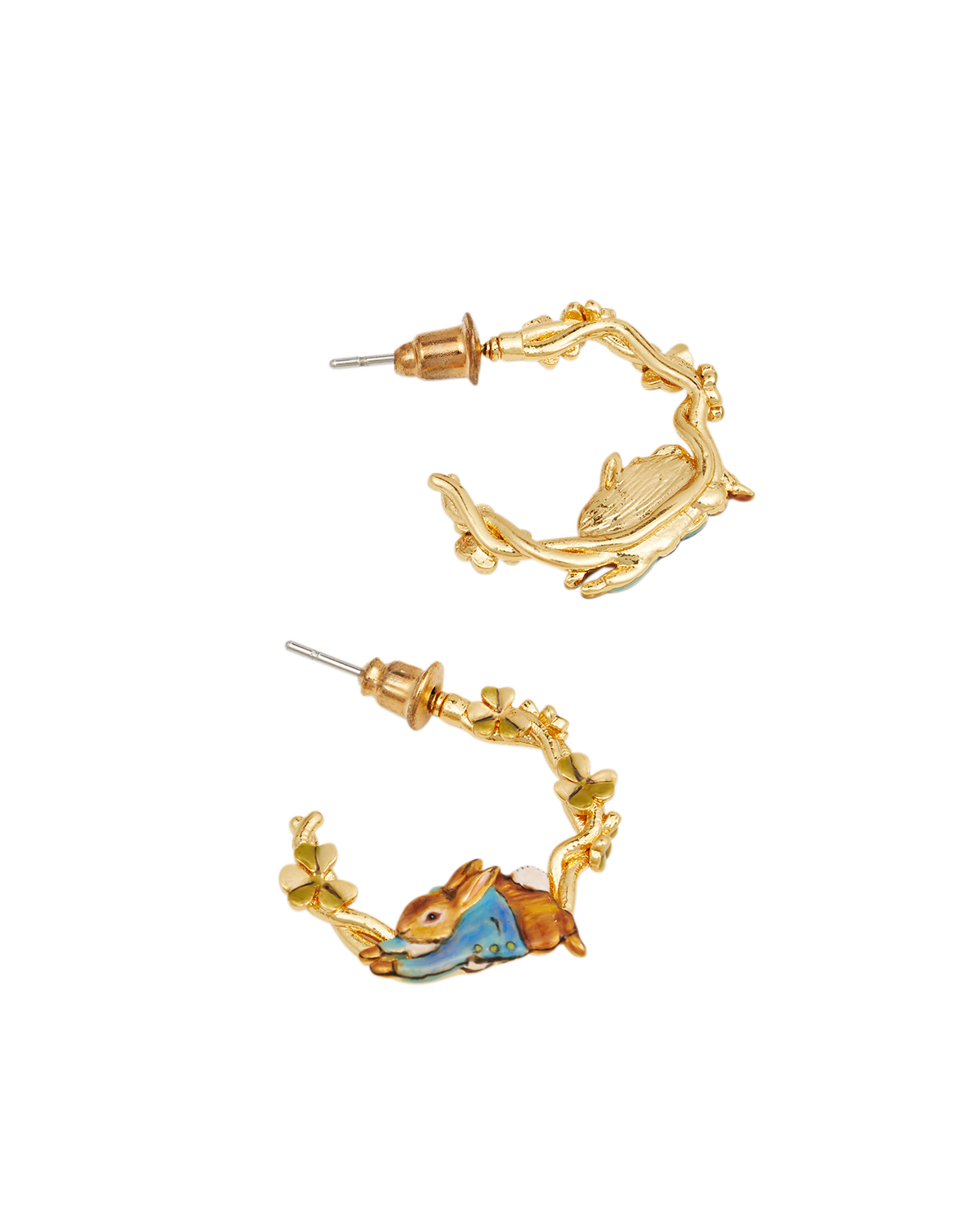 Gold earrings with peter rabbit designs on a white background