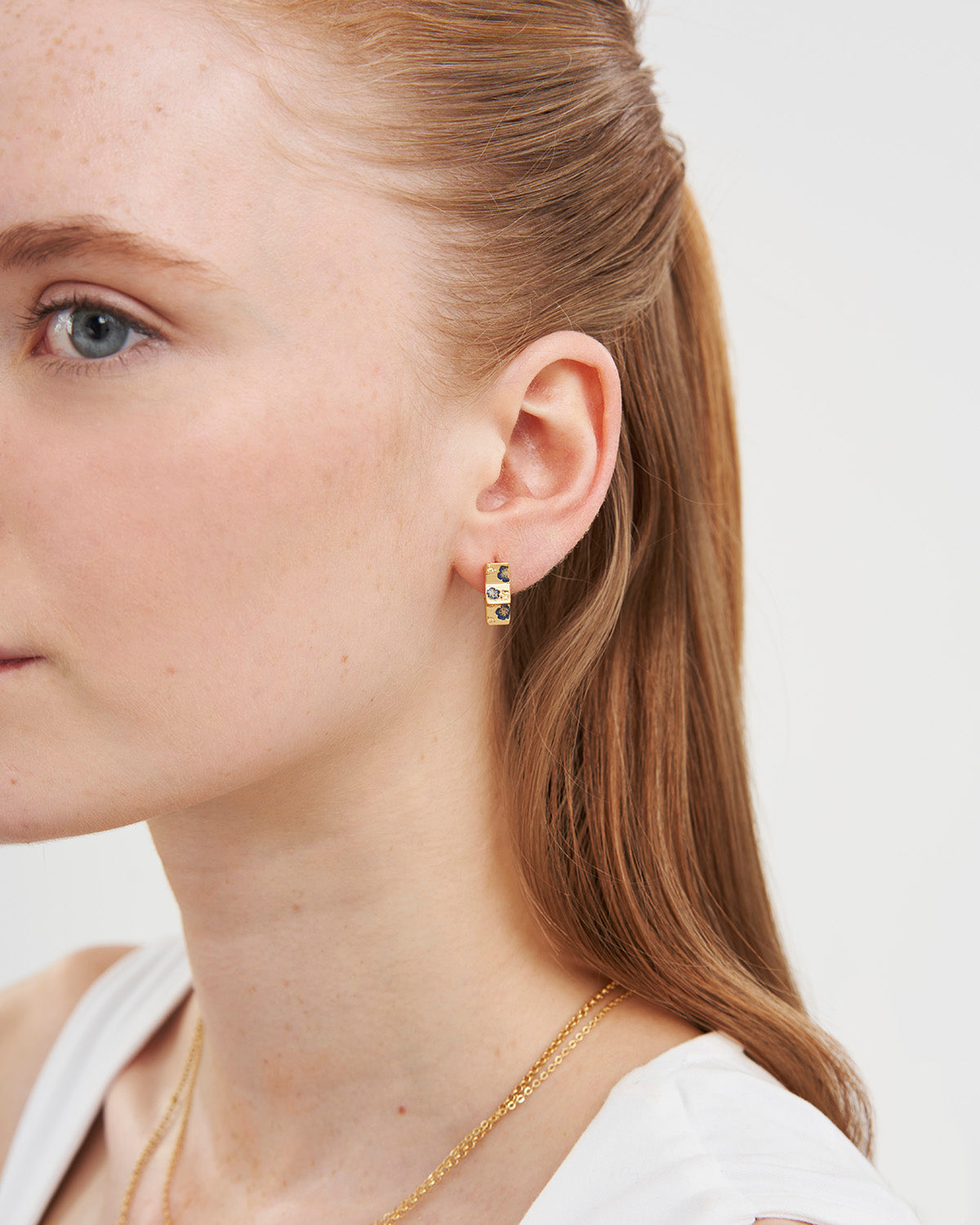Larkspur Huggie Earrings in Gold
