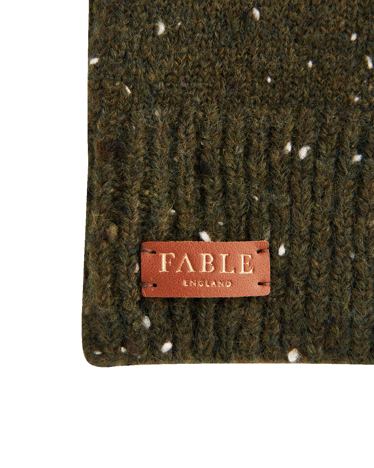 Green knitted fingerless gloves with a alternative brown leather patch displaying 'Fable England' on a white background