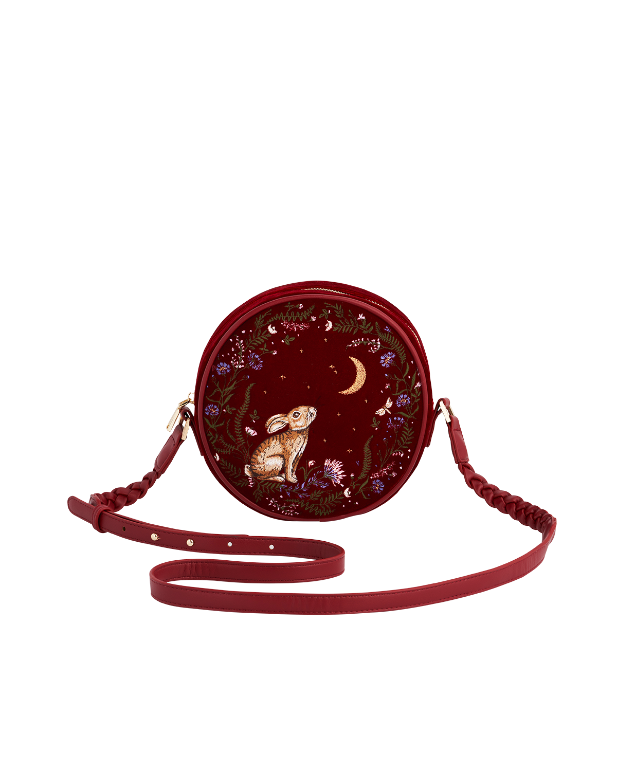 Round red bag with a rabbit and floral design on a white background