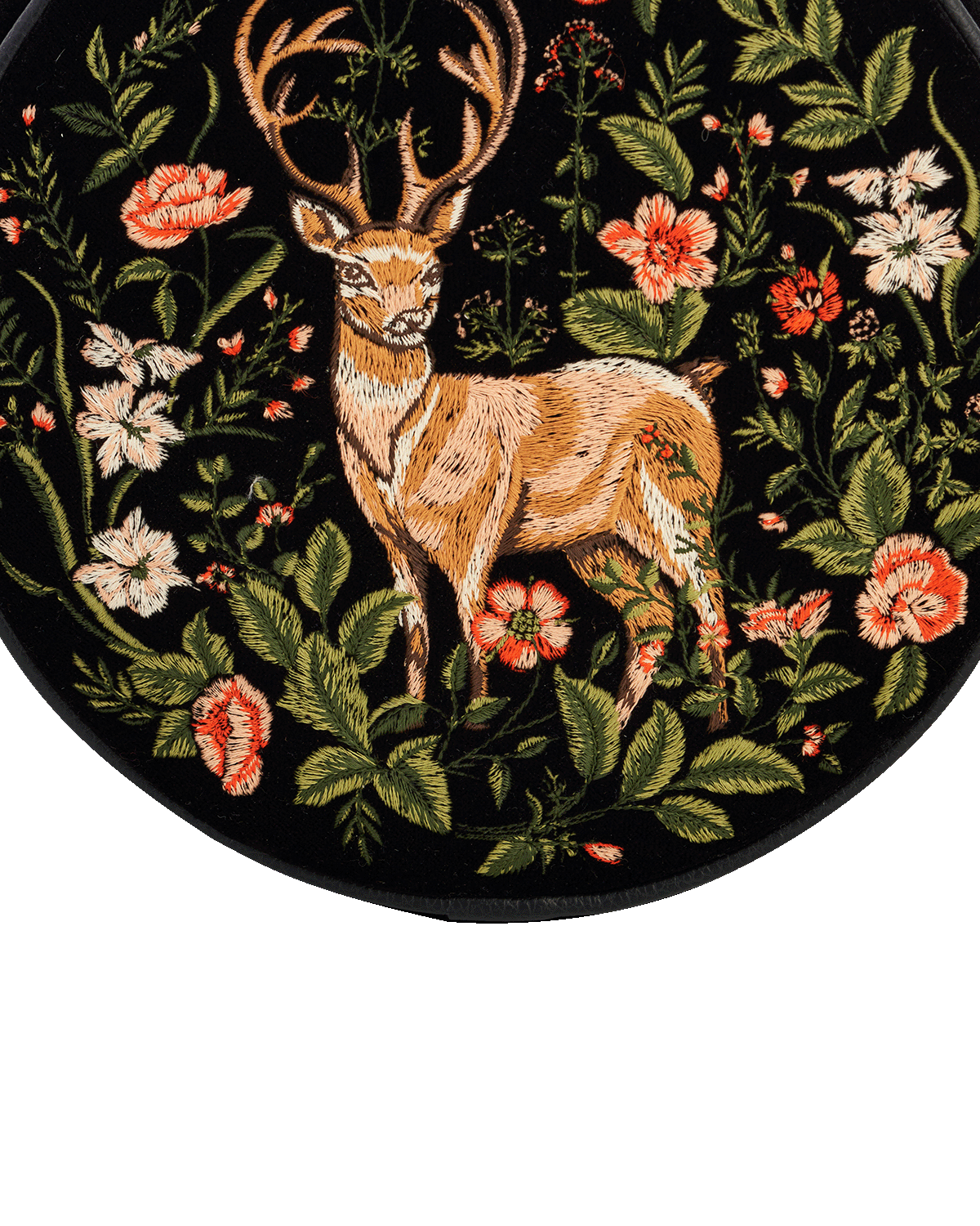 Embroidered design of a deer surrounded by flowers on a black background