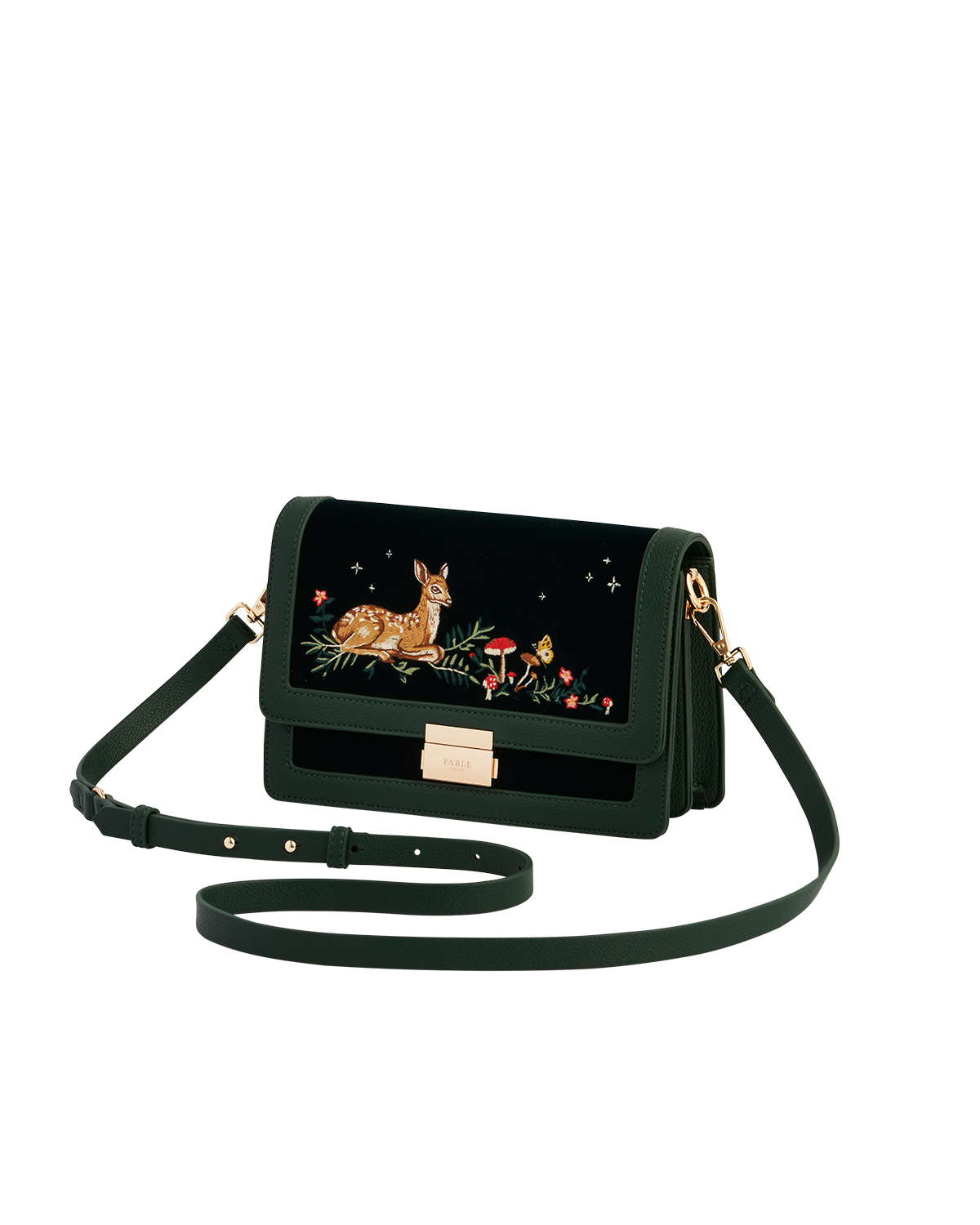 Green handbag with a fawn and mushroom design on a white background