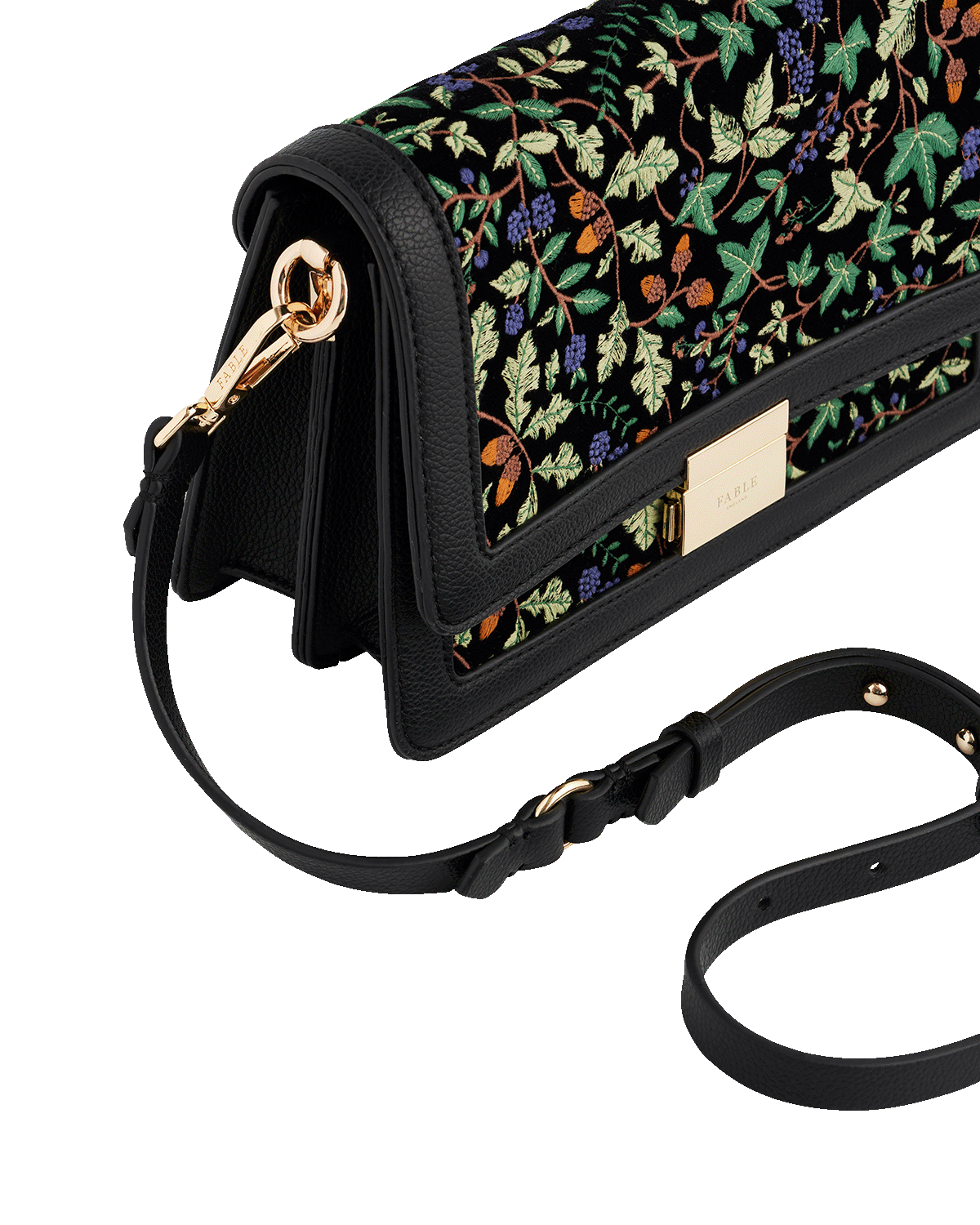 oak leaf patterned handbag with a black strap on a white background