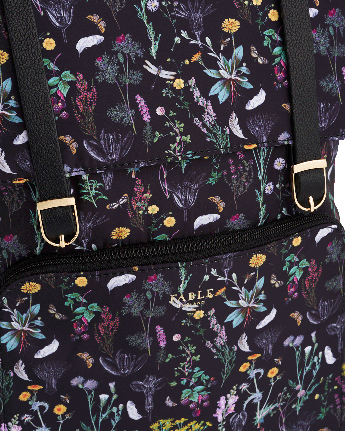 Backpack with floral pattern and visible brand name on a dark background