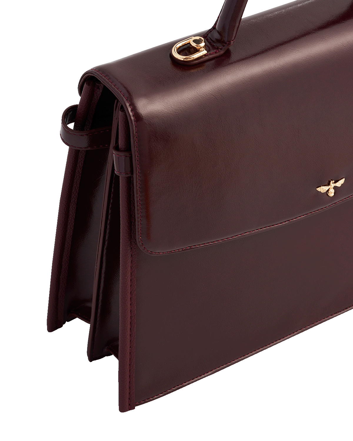 Cherry red alternative leather handbag with a gold clasp on a white background