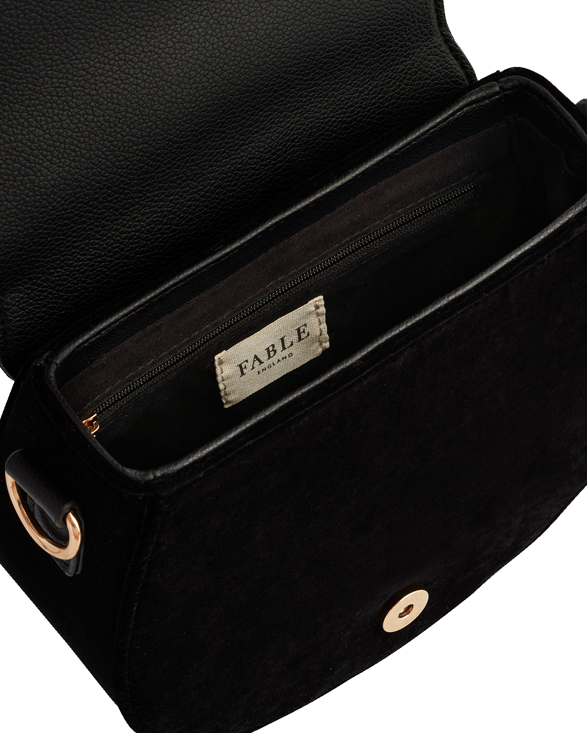 Black leather bag with 'Fable England' label on a white background