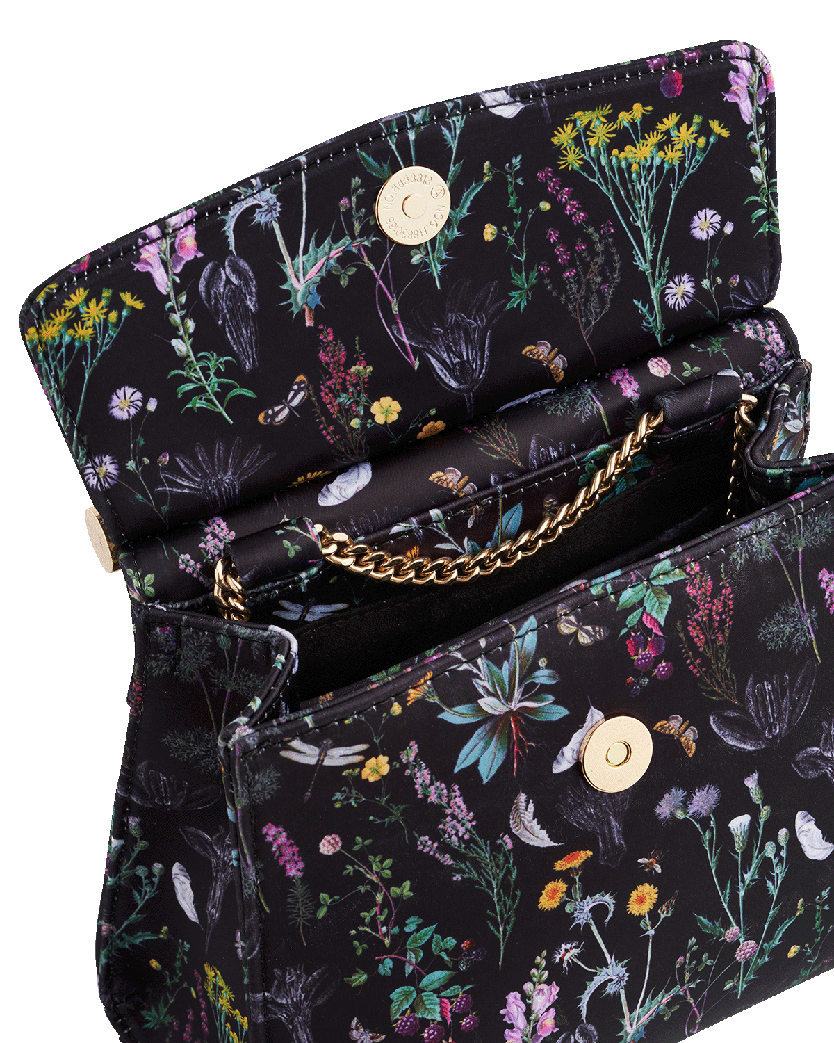 Floral-patterned handbag with gold chain on a black background
