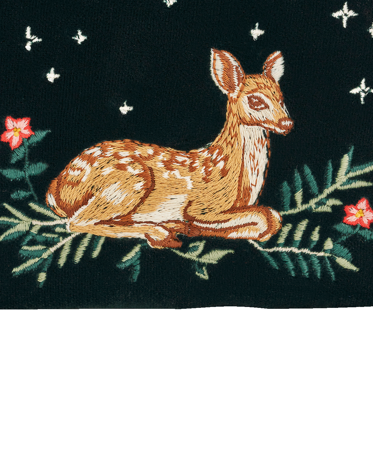 Embroidered fawn surrounded by foliage and flowers on a dark background