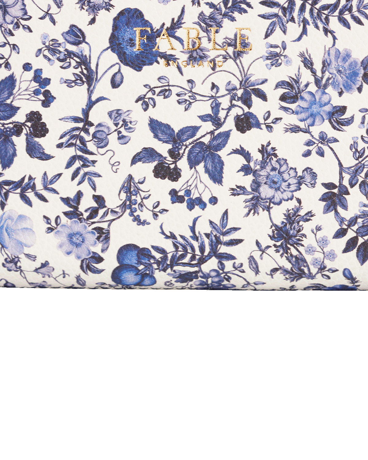 Floral pattern with blue flowers and leaves on a white background, featuring the brand 'Fable England'.