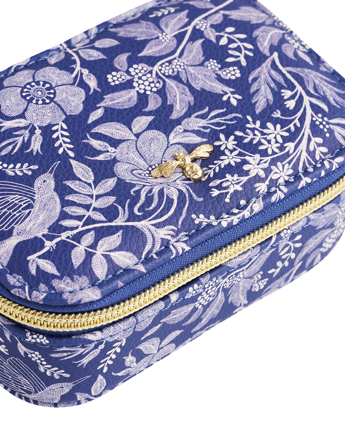 Blue floral-patterned jewellery case with gold zipper and bee detail on a white background