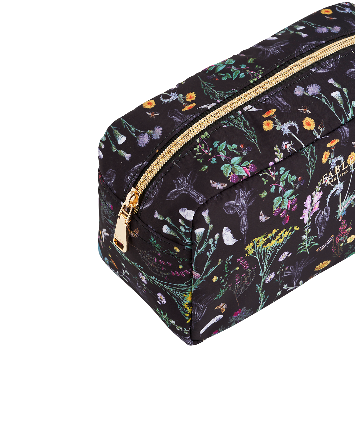 Rectangular toiletry bag with floral pattern and gold zipper on a white background