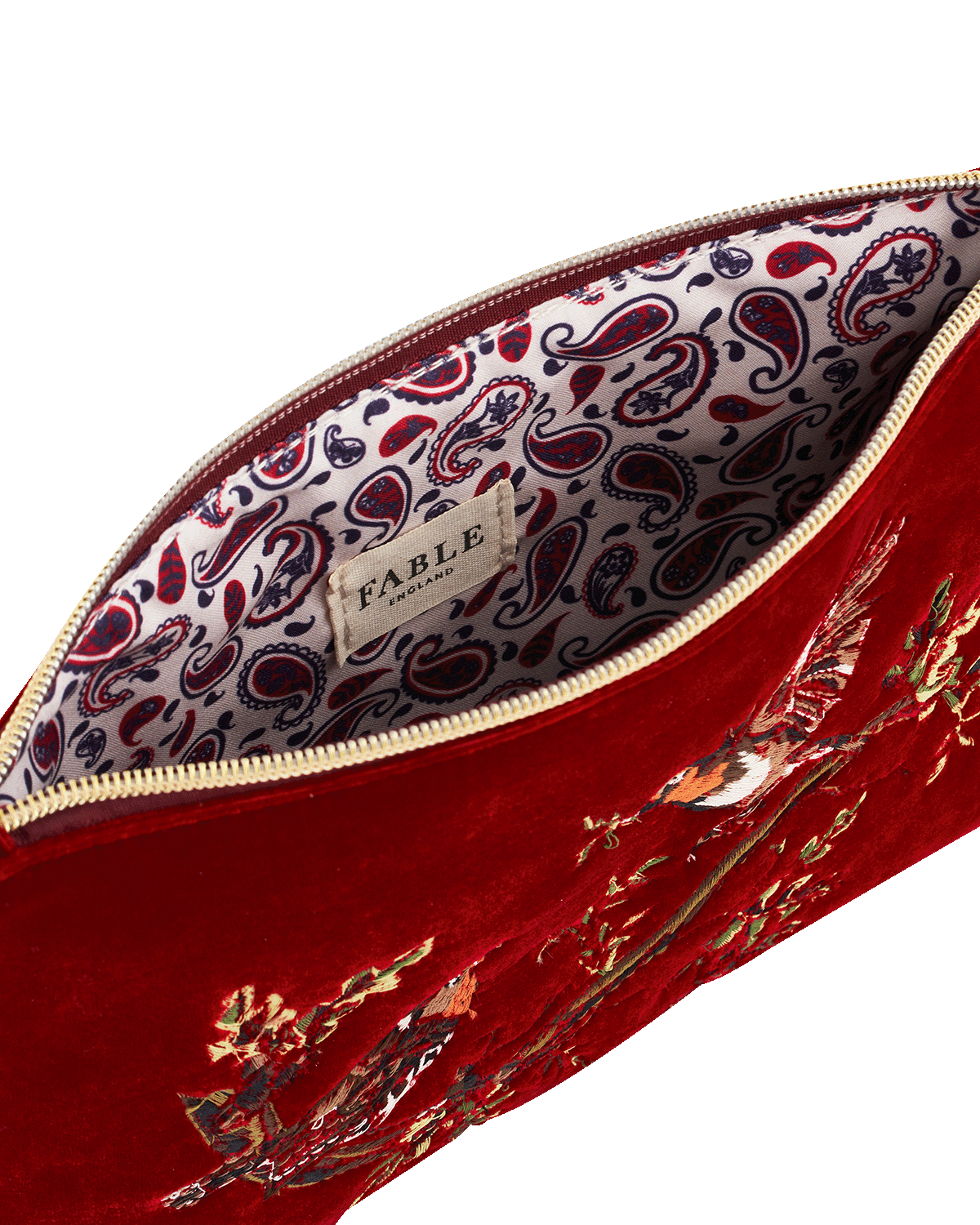 Red embroidered velvet pouch with paisley patterned interior, Fable brand visible