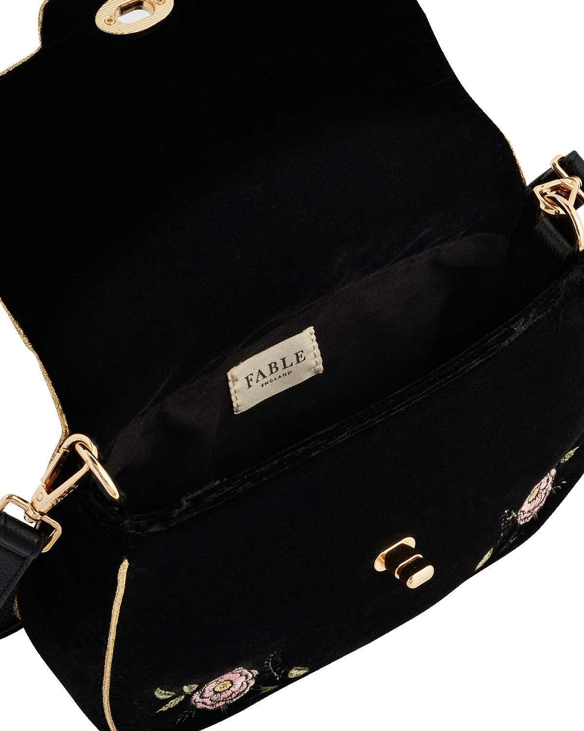 Black bag with gold accents and 'Fable England' branding on a white background
