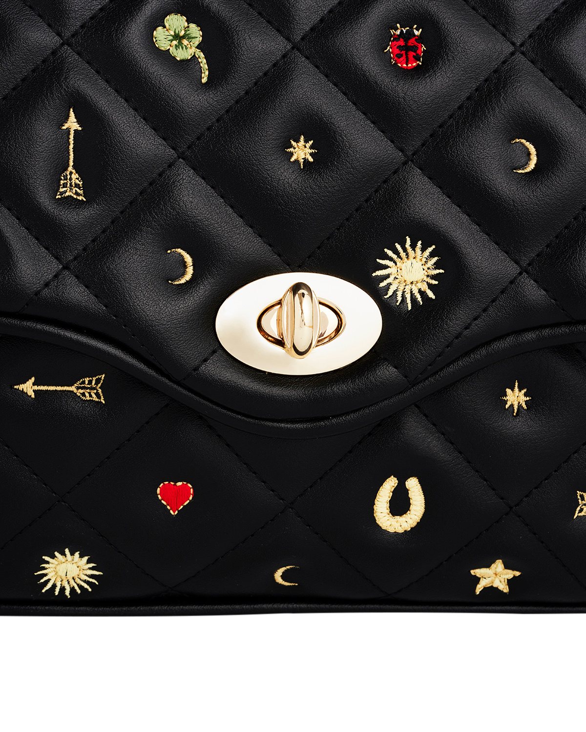 Black quilted handbag with gold embroidered design and decorative elements on a white background