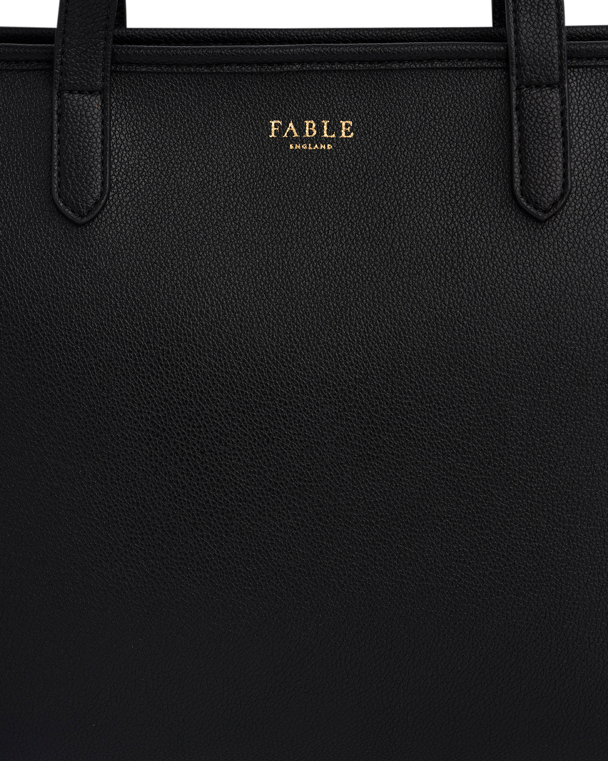 Black leather bag with 'Fable' branding on a black background