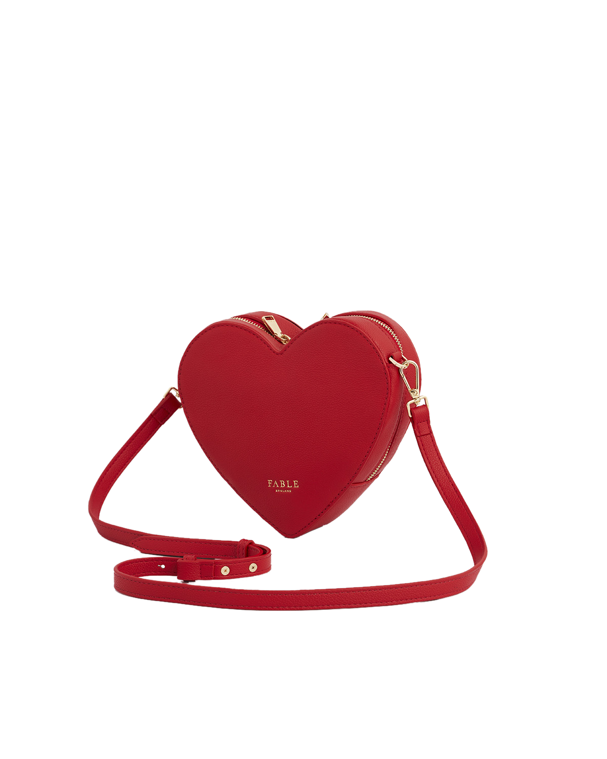 Red heart-shaped handbag with a strap on a white background