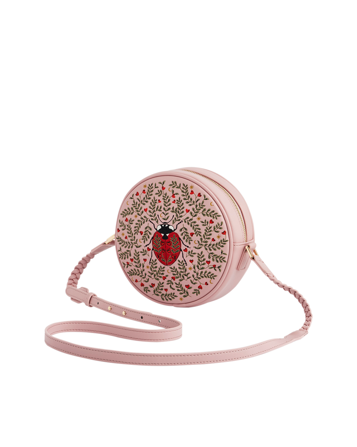 Pink round crossbody bag with a ladybug design on a white background