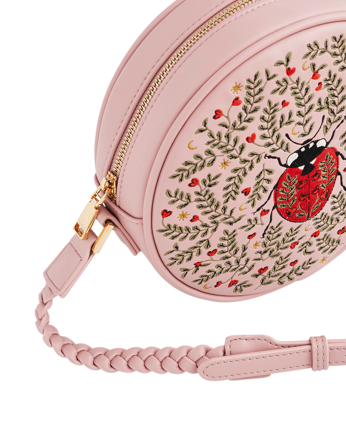 Pink round embroidered bag with a ladybug design on a white background