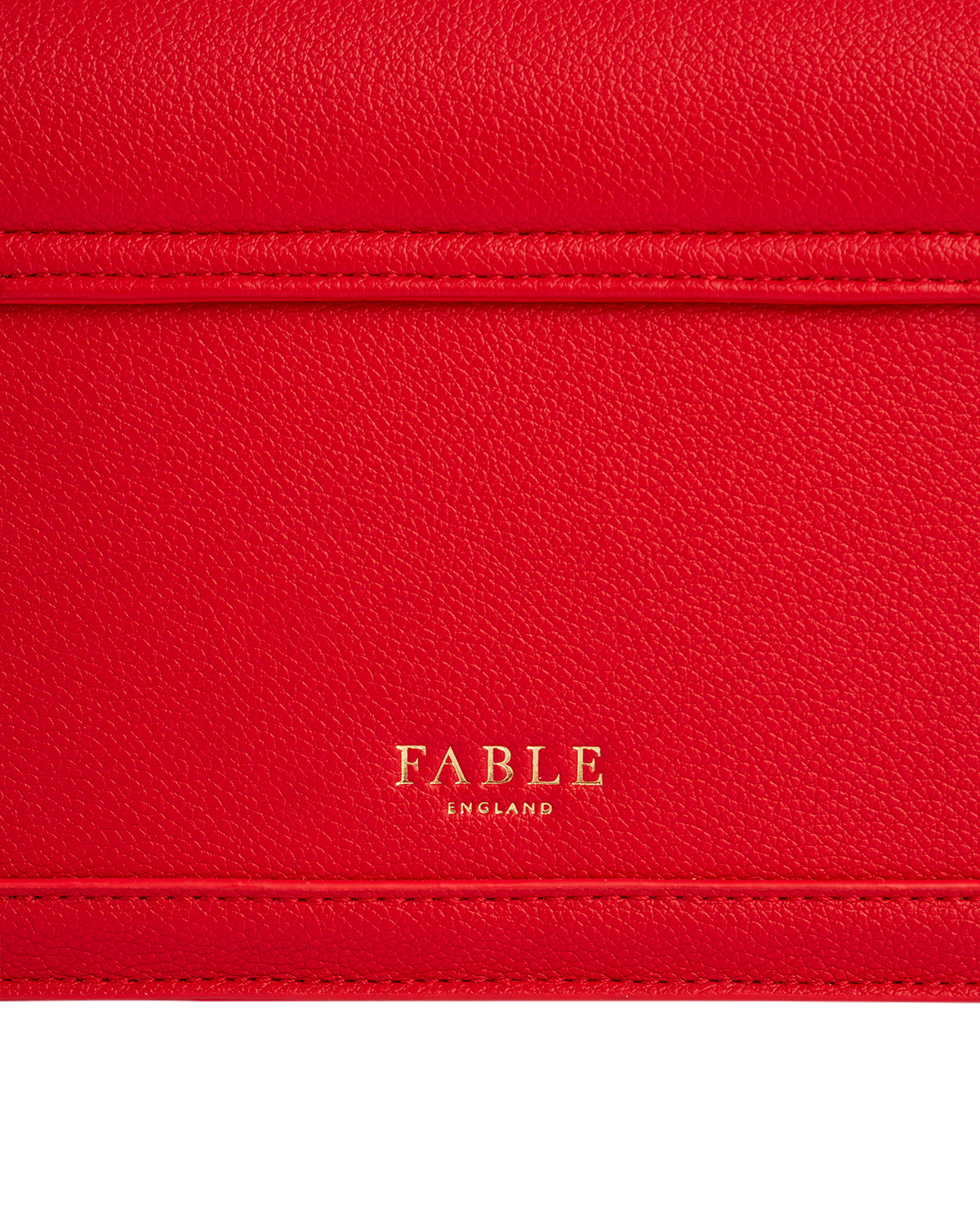 Red bag with gold FABLE logo