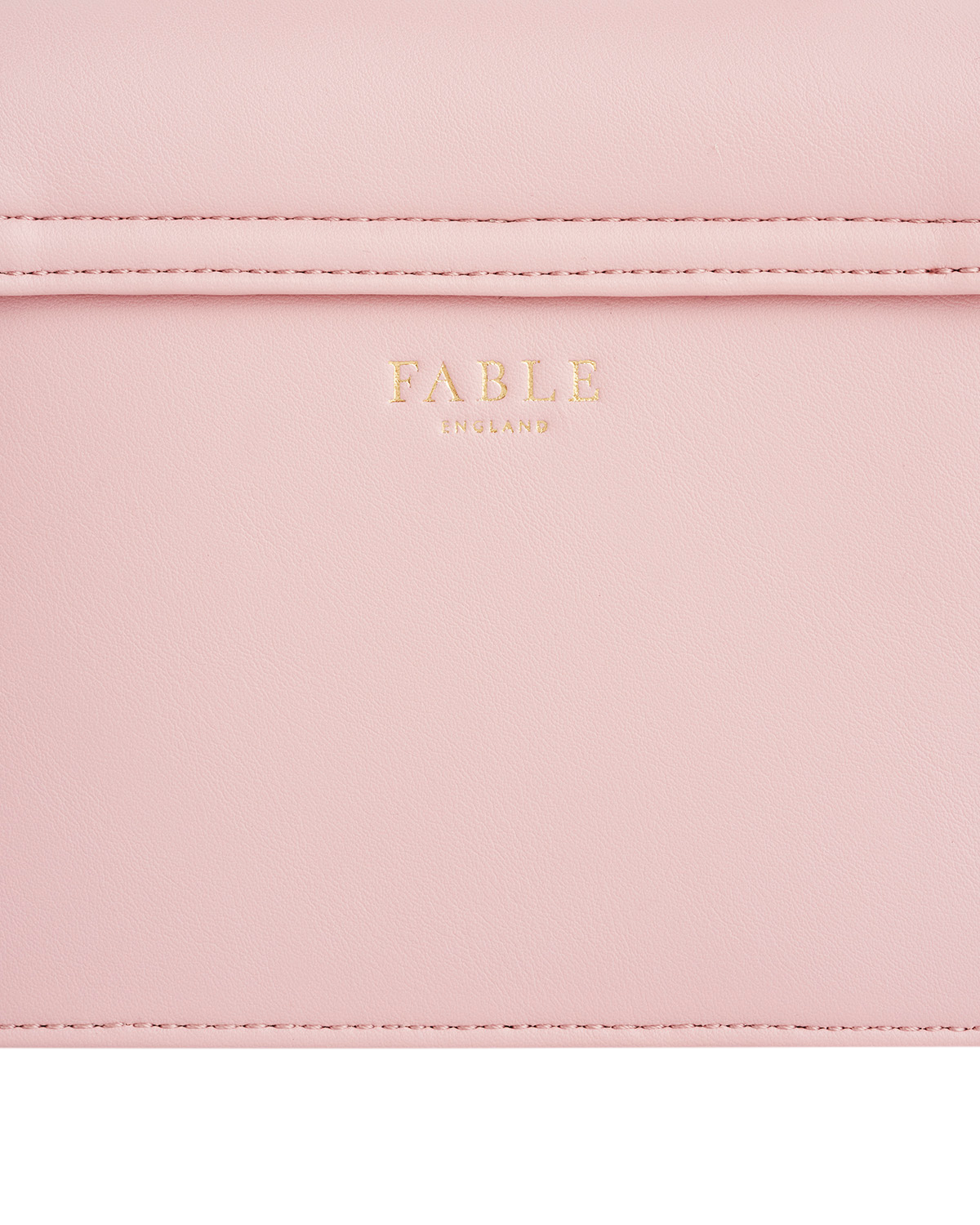 Close-up of a pink product with 'Fable' branding.