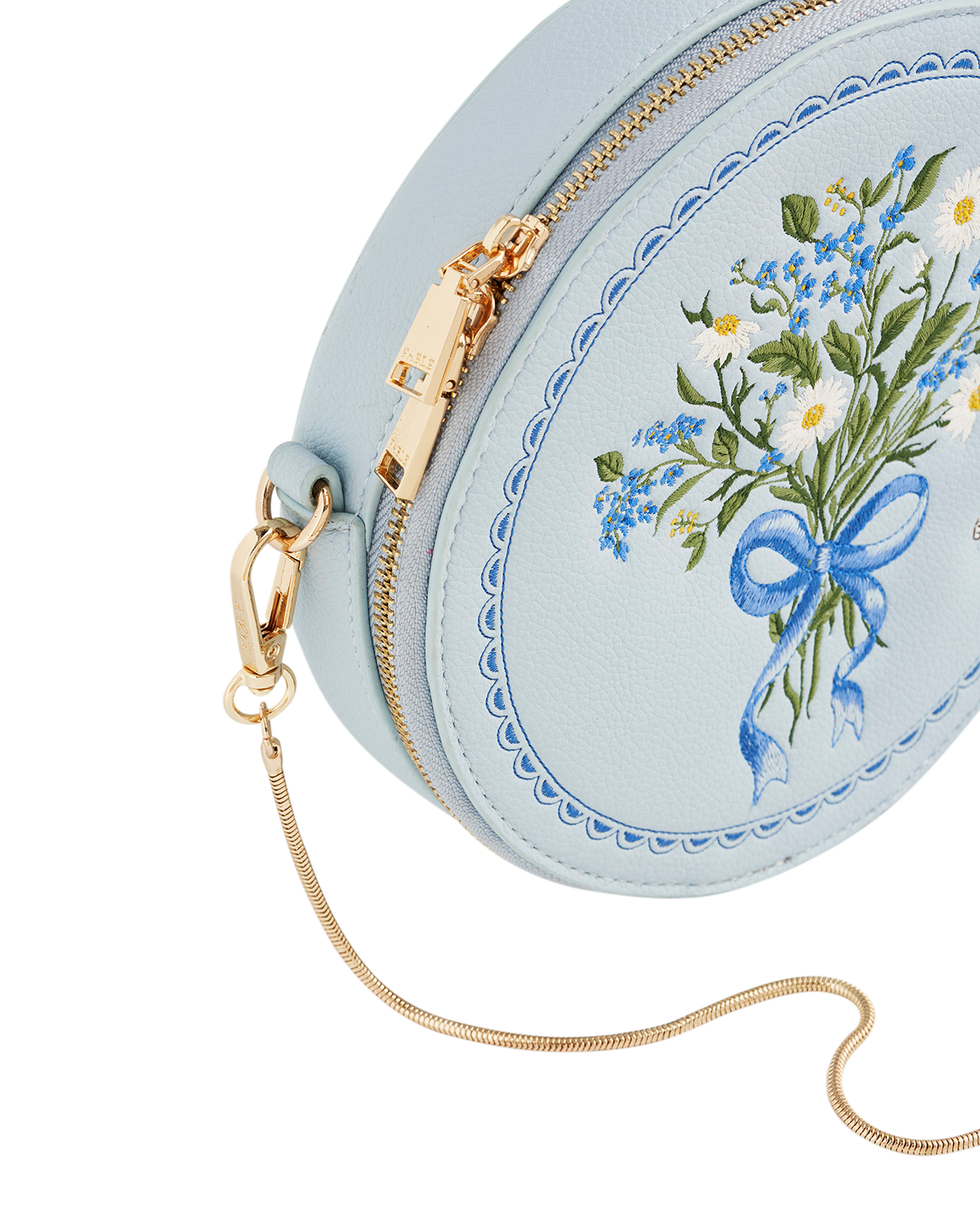 Light blue round bag with floral embroidery and gold zipper on a white background