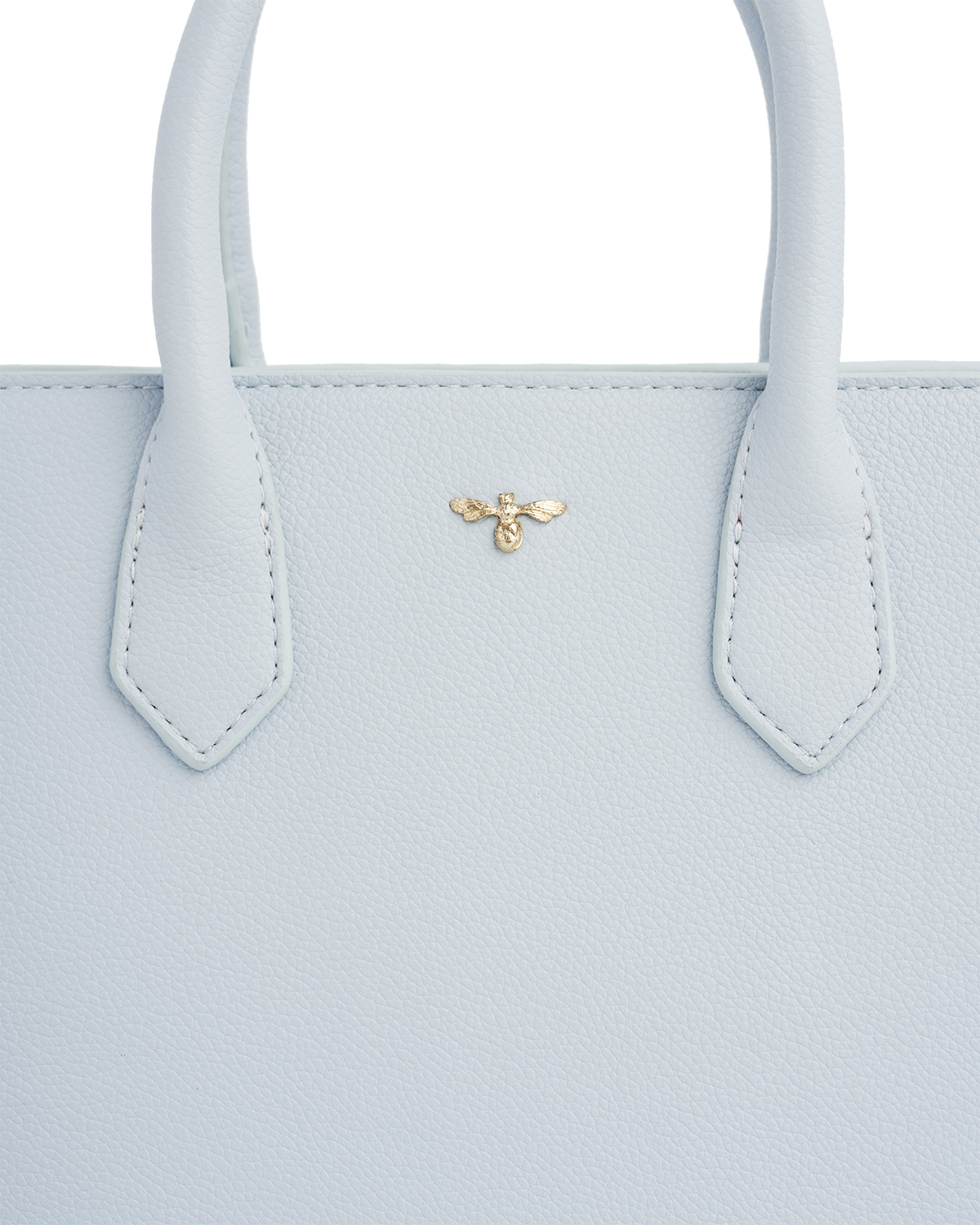 Light blue handbag with a gold bee emblem on a white background