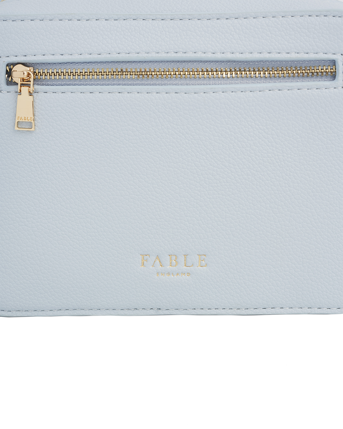 light blue bag with fable logo and gold zipper