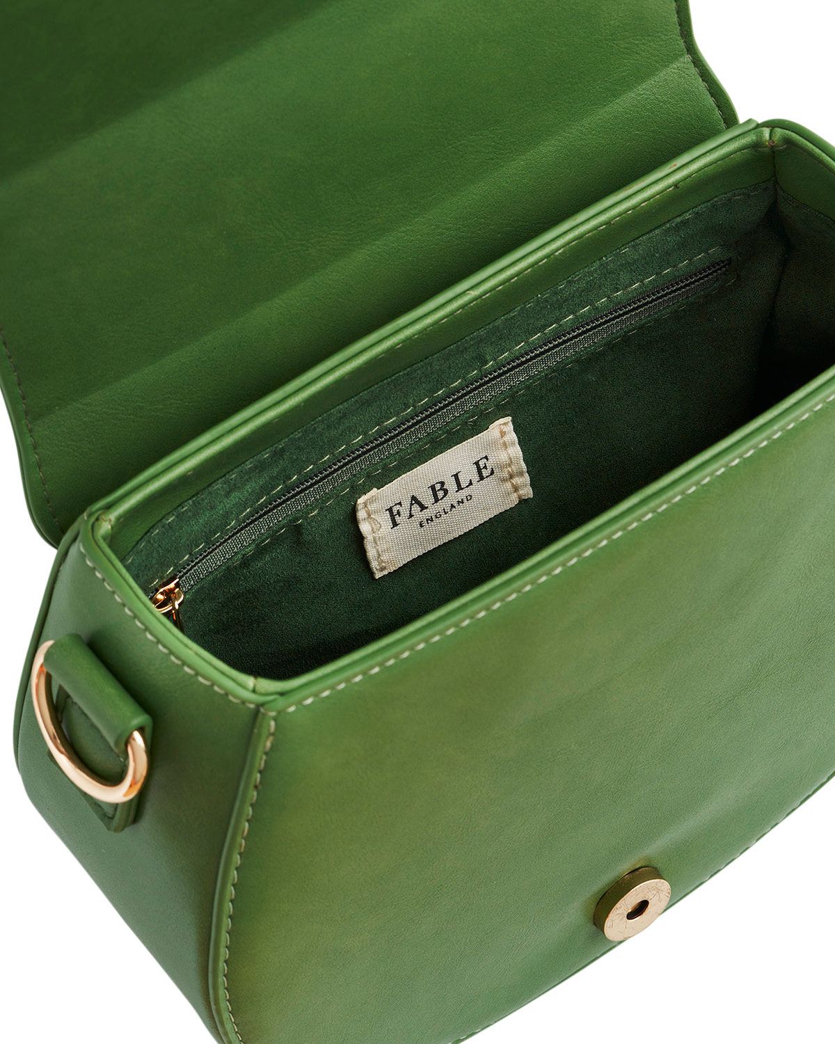 Green leather handbag with 'Fable' label on a white background